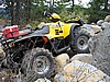 05. Ken parks his ATV on a rock to show clearance.jpg