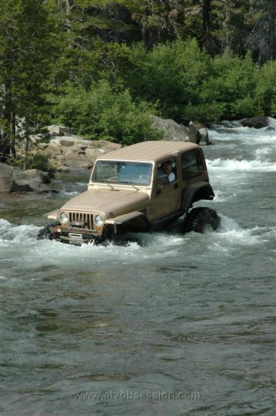 25. Crossing wasn't enough, he decides to chase some fish down stream..jpg