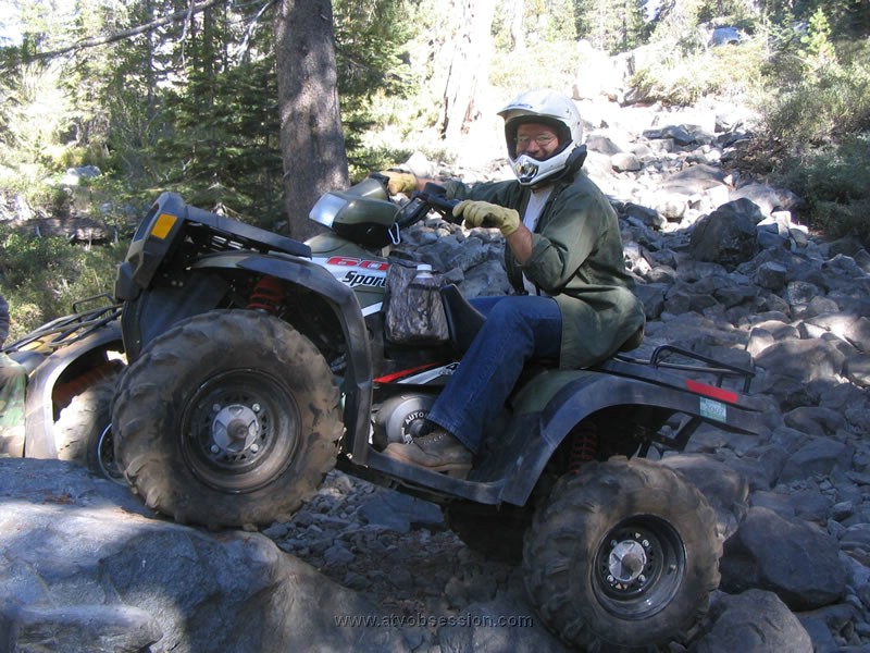 030. Chad relaxes on a rock..jpg
