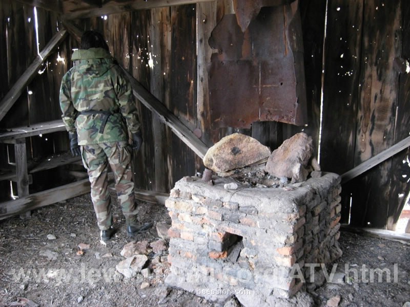 150. Lori checks out the inside with a nice brick fireplace..jpg